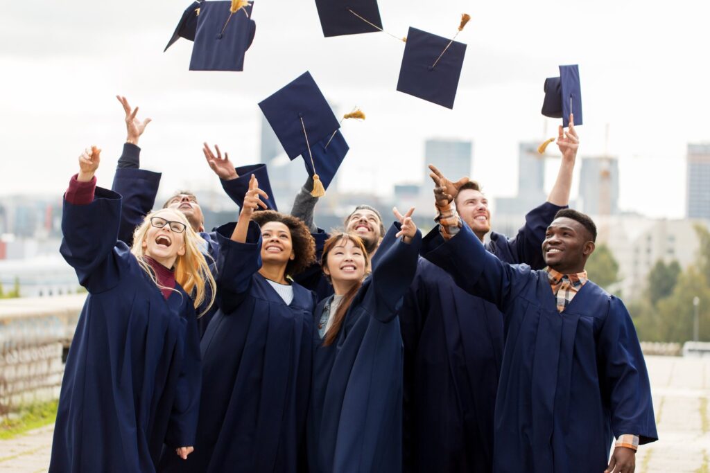 Graduates throwing their caps in the air